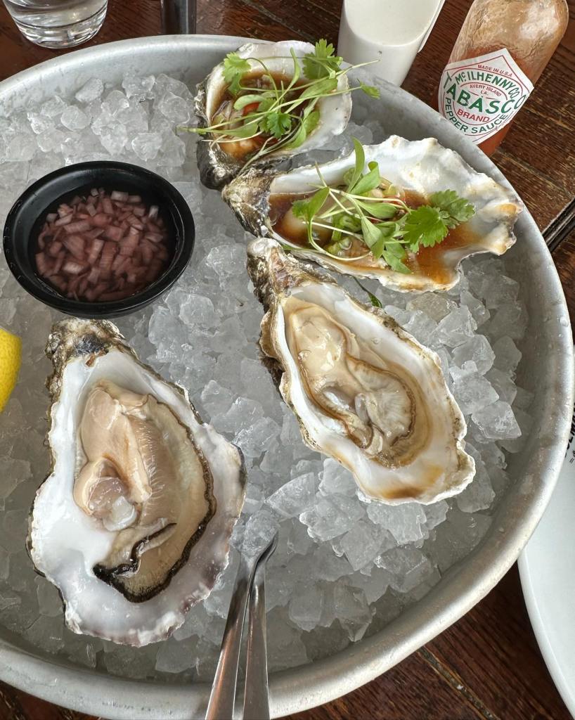 Fresh Oysters in ice served with fresh lemon wedge and Tabasco sauce at Colmans Seafood Temple.