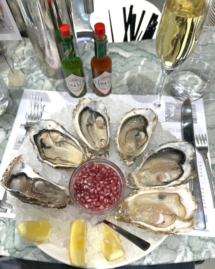 Fresh Lindisfarne oysters served on ice with lemon wedges at Saltwater Fish Company, Newcastle