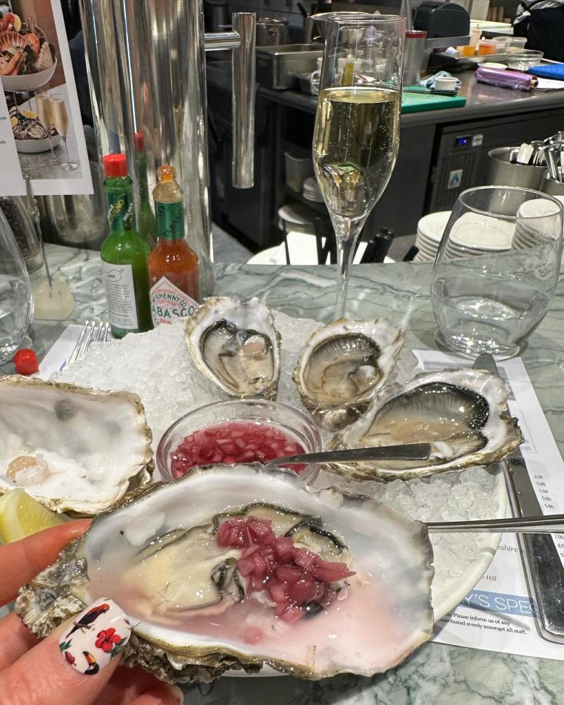 Fresh Lindisfarne oysters served on ice with lemon wedges at Saltwater Fish Company, Newcastle