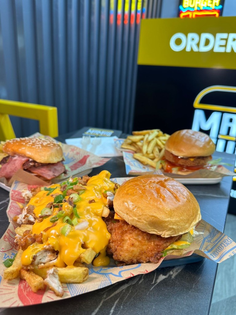 Blazing Chick Burger: The Blazing Chick burger with golden buttermilk fried chicken, garnished with spicy sauce