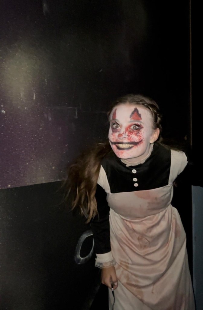 Nightmare at Rainton, a haunting girl with facepaint and blood on her overalls