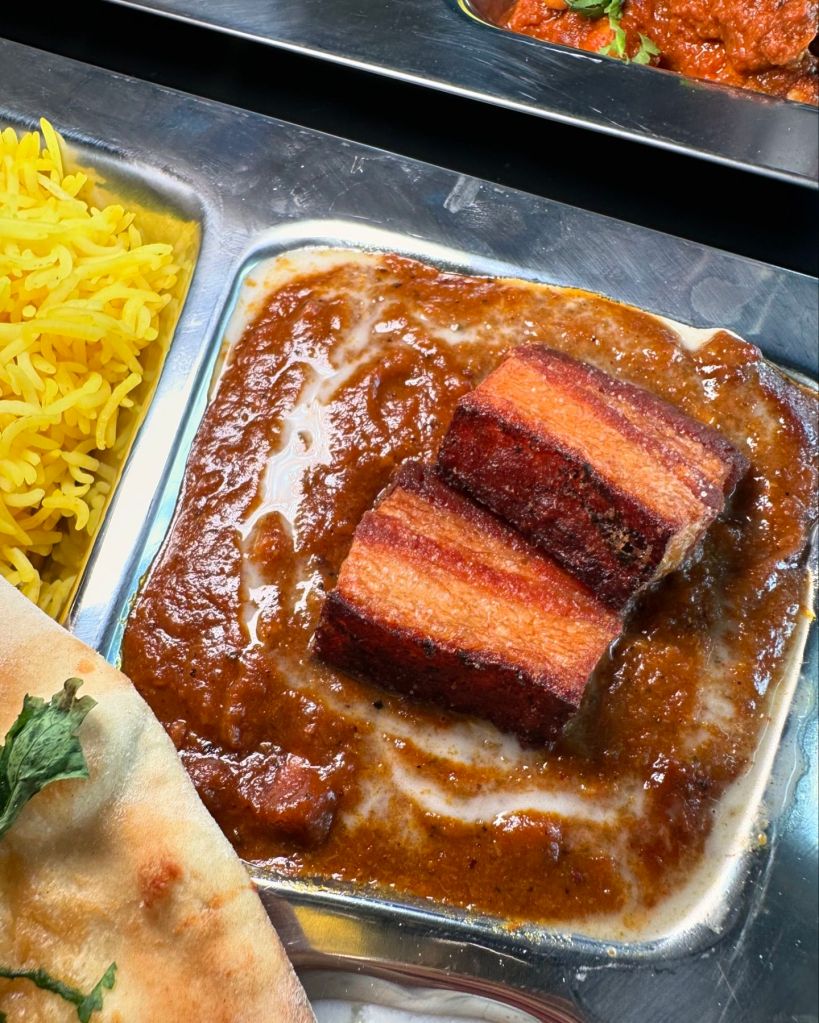 Goan Thali from Thali Tray, including Pork Belly Vindaloo, Chicken Xacuti, and accompanying sides