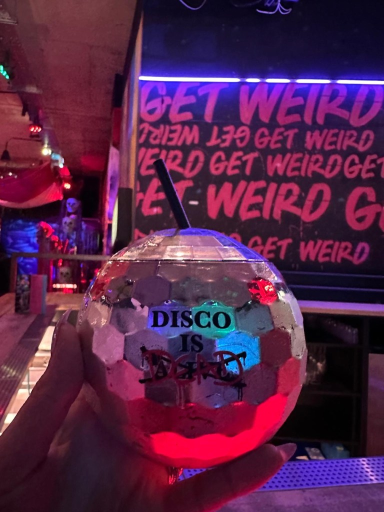 Festive cocktails including Who Killed Santa? and Junkyard Punch at Junkyard Golf Club, showcasing colorful and inventive drinks