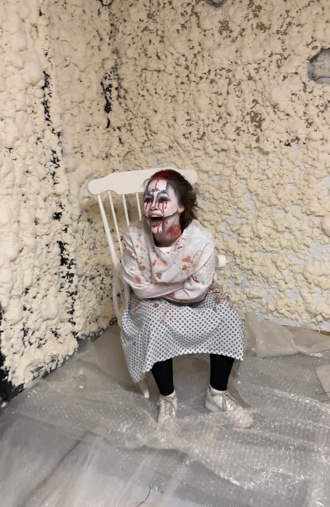 Nightmare at Rainton, a girl in a straight jacket with blood on her clothing. A scary Halloween walk scene