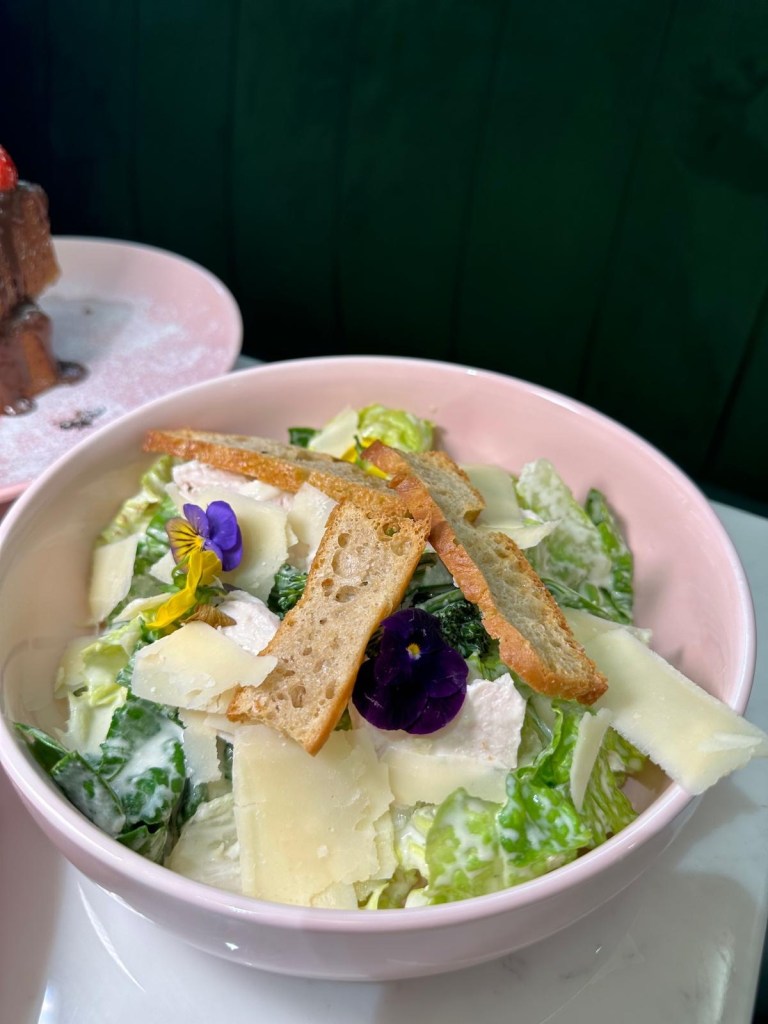 Caesar Salad: A fresh bowl of romaine lettuce, crunchy croutons, Parmesan shavings, and creamy Caesar dressing