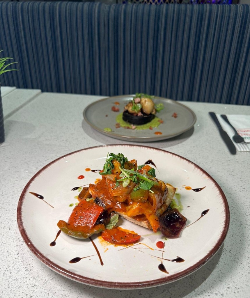 Piri Piri Tiger Prawns: Spicy Piri Piri Tiger Prawns on garlic crostini sourdough with Cajun peppers at Mamas Bar and Grill, a perfect seafood starter with bold, fresh flavors