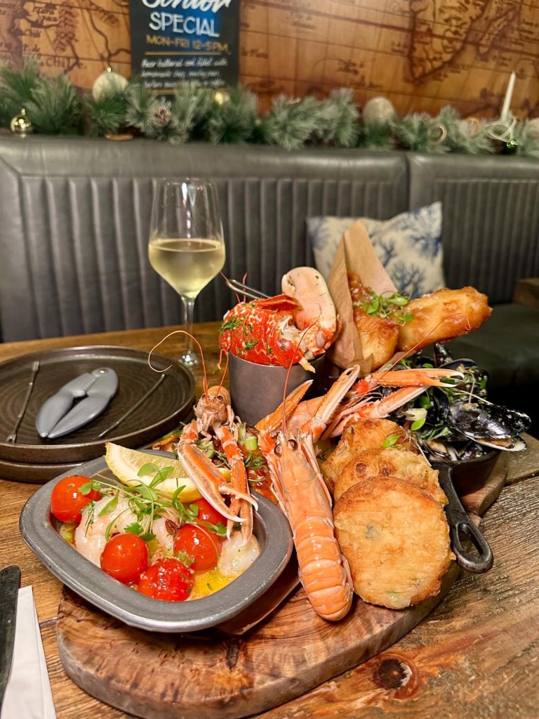 Succulent garlic butter lobster from Dodgin's Yard, cooked to perfection with tender meat soaked in rich garlic butter, served fresh from The Stella Maris trawler. Stella Maris langoustines "Sweet and delicate Stella Maris langoustines, freshly caught and served with their juicy, tender meat nestled in their shells. Fish cakes Golden, crispy fish cakes with a soft, flaky fish filling, handcrafted and packed with bold flavors. Cod goujons Lightly battered cod goujons, fried to a crisp golden brown and served fresh, highlighting the catch of the day. Moules marinière Plump, juicy mussels served in a rich, creamy moules marinière sauce, garnished with herbs and paired with crusty bread for dipping. Garlic prawns Perfectly cooked garlic prawns, tender and full of bold, buttery flavors, making them a standout seafood delight. Firecracker salmon Smoky and charred firecracker salmon, seasoned with a fiery blend of spices and served as a chunky, flavorful fillet.