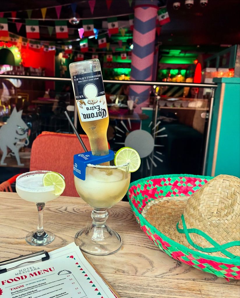 Signature Drinks: The Bull dog, an interesting drink with frozen margarita and an upside down bottle or corona. Also a refreshing margaritas and cocktails with tropical garnishes, capturing the lively essence of Motel Mexicana’s bar.