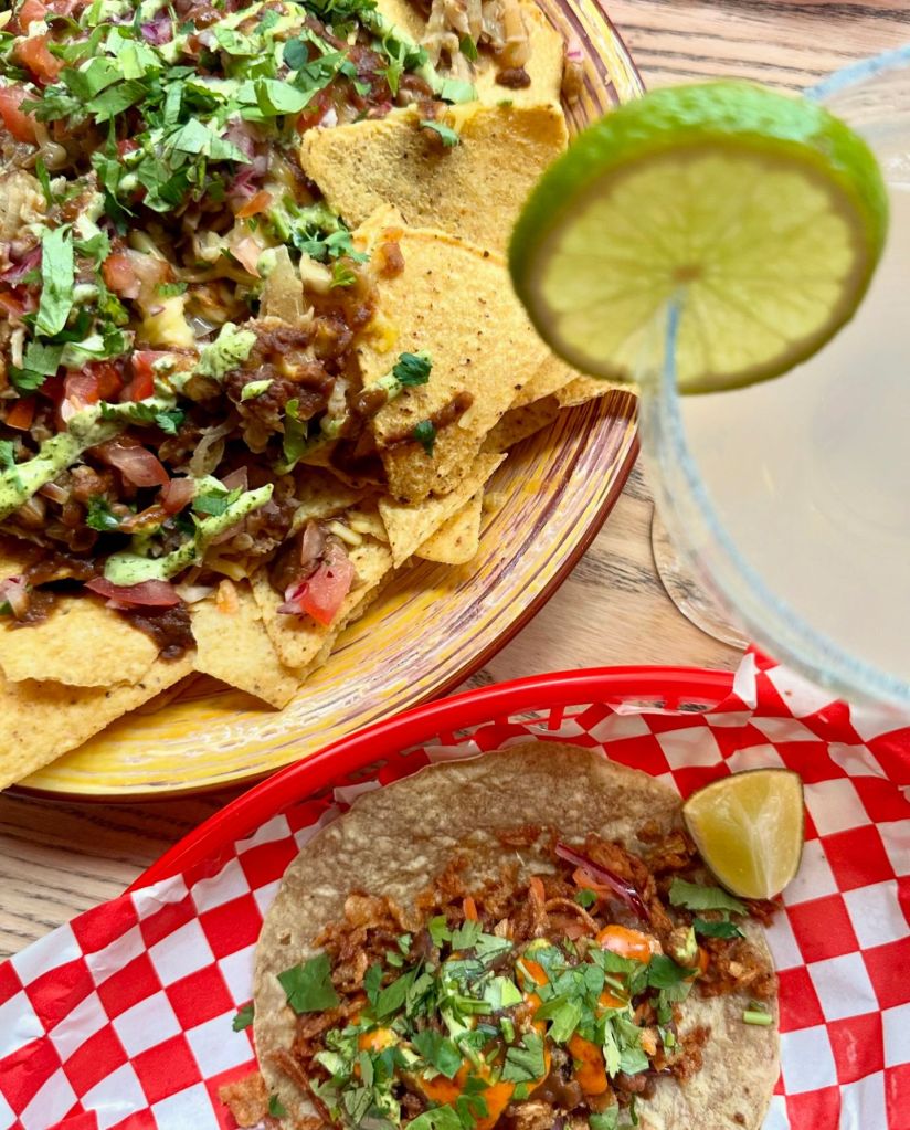 Tacos: Close-up of assorted tacos filled with flavorful ingredients like seasoned meats, fresh vegetables, and zesty sauces.