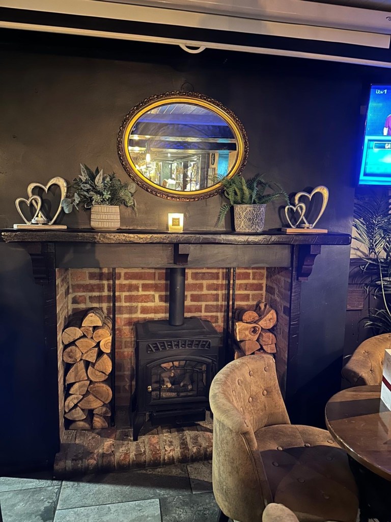 Inviting and cozy interior of Spread Eagle, North Shields, with warm lighting, rustic decor, and a friendly atmosphere, perfect for a relaxed dining experience.