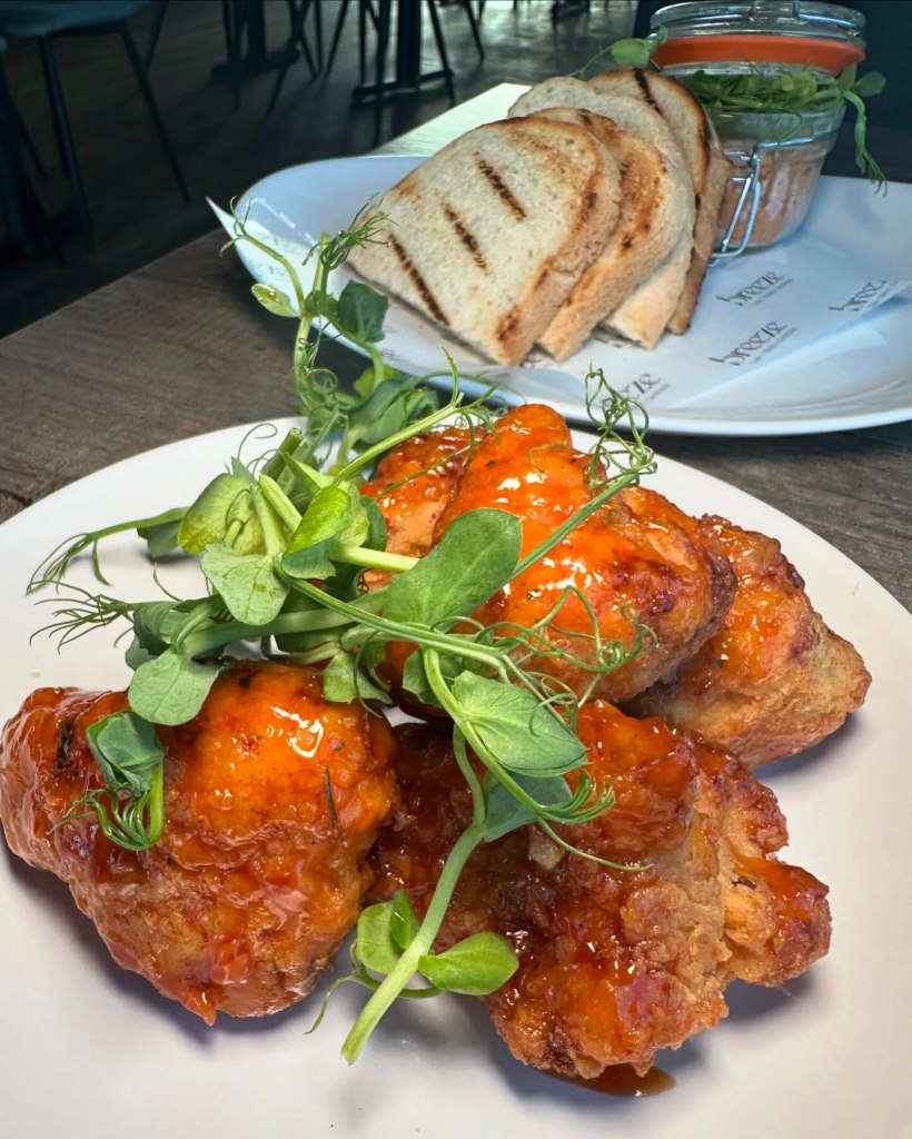 Crispy and golden cauliflower dish at Breeze Lounge, featuring bold flavors and a delightful texture