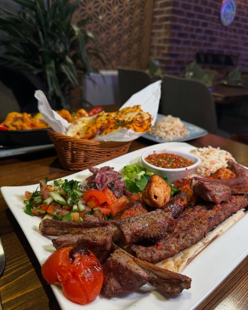 Saray Mixed Grill featuring marinated lamb, chicken breast, lamb chops, ribs, and adana with rice, salad, and chili sauce at Saray Turkish Restaurant, Jesmond