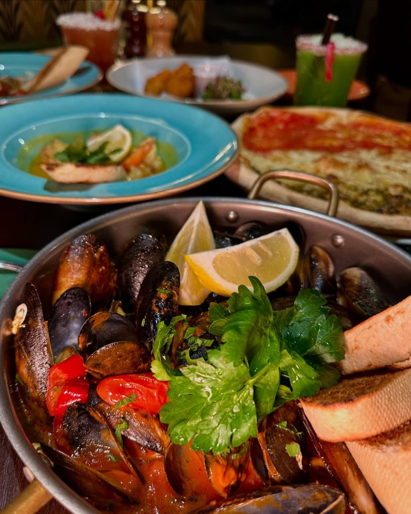 Freshly cooked mussels in a rich sauce served with toasted bread at Fabio’s Italian Restaurant