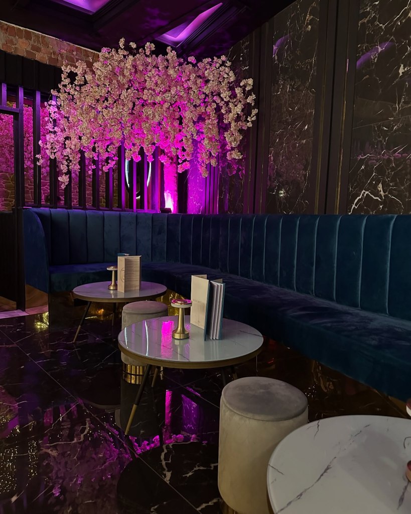 Beautifully decorated interior of Ziiza Lounge and Grill with modern, cozy seating