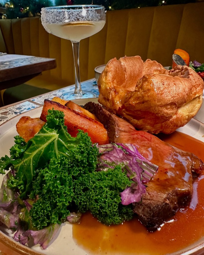 Roast sirloin of beef with mashed potatoes, roasties, Yorkshire pudding, and gravy at Horticulture