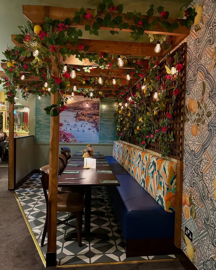 Stunning interior of Fabio’s Italian Restaurant featuring elegant décor, a pergola corner, and a stylish bar area