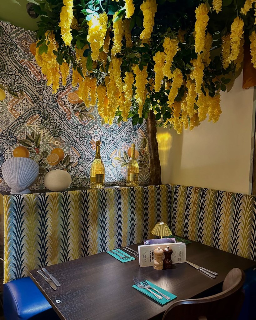 Stunning interior of Fabio’s Italian Restaurant featuring elegant décor, a pergola corner, and a stylish bar area.