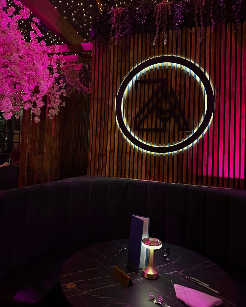 Cozy booths in a beautifully decorated dining area at Ziiza Lounge and Grill.