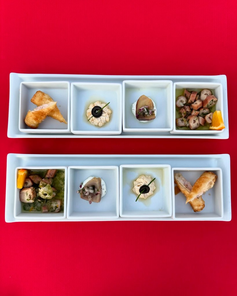 An array of dishes at TUI Blue Seno, including Turkish meze platters, fresh seafood, and vibrant international cuisine served in a scenic al fresco dining area.