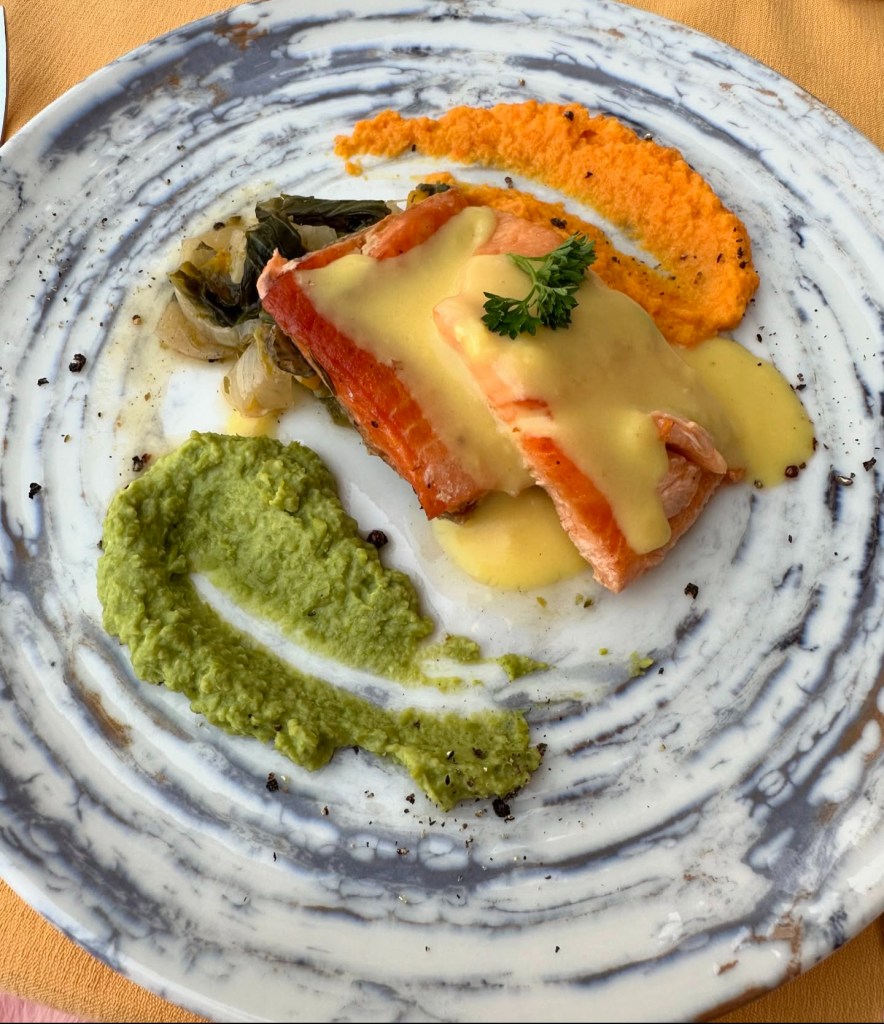 An array of dishes at TUI Blue Seno, including Turkish meze platters, fresh seafood, and vibrant international cuisine served in a scenic al fresco dining area.