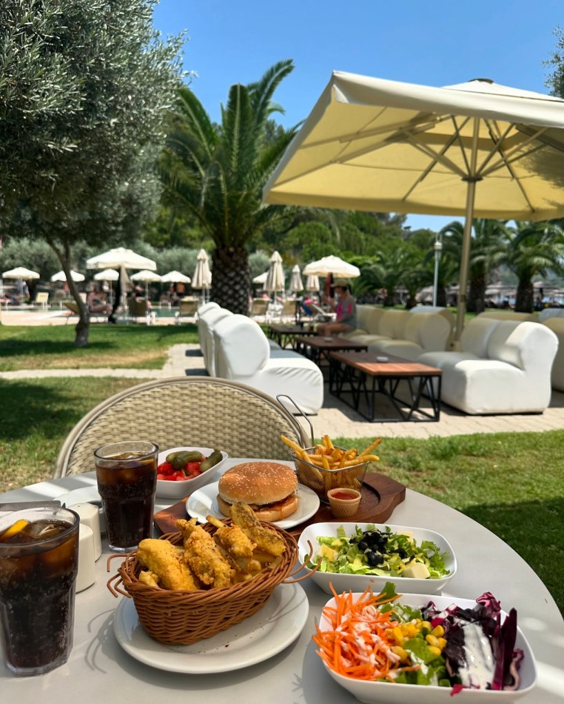 An array of dishes at TUI Blue Seno, including Turkish meze platters, fresh seafood, and vibrant international cuisine served in a scenic al fresco dining area.
