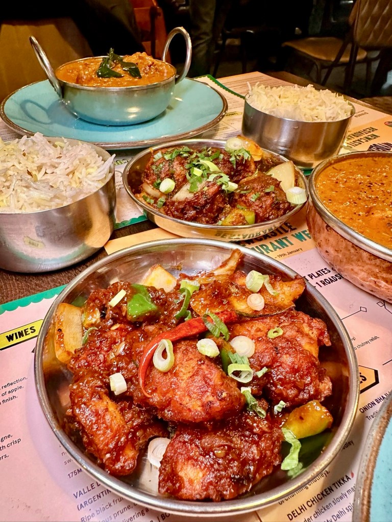 A bowl of Cauliflower Manchurian from My Delhi, with crispy fried cauliflower tossed in a glossy, tangy sauce