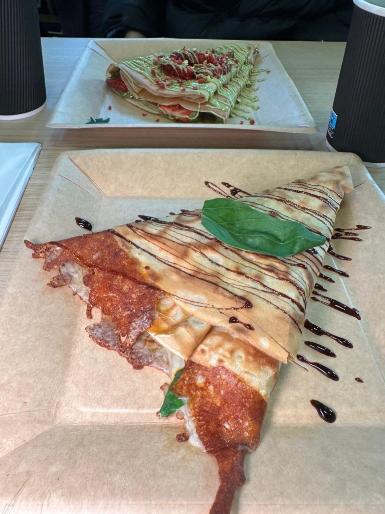 A savoury crepe filled with mozzarella, cheddar, and zesty tomato pesto, served warm and folded to perfection.