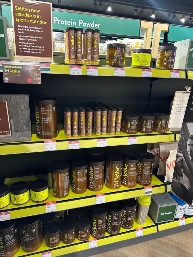 A selection of protein snacks, vitamins, and wellness products neatly displayed at the new Holland & Barrett store in Newcastle.