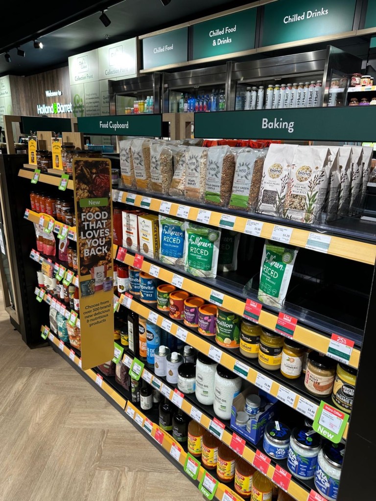A promotional sign inside the new Holland & Barrett store offering a 20% discount with the code NEWCASTLE20.