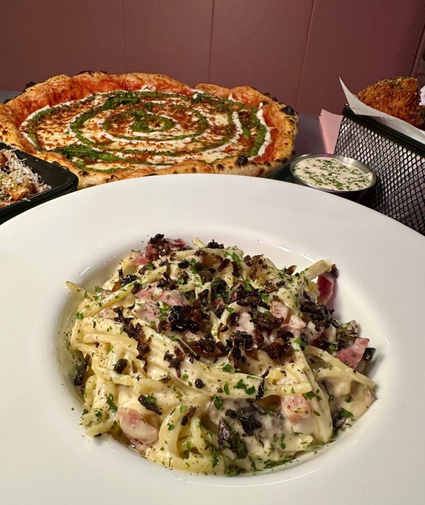 Fungi Truffle Pasta at Circo Italian, topped with pan-fried mushrooms and fresh basil