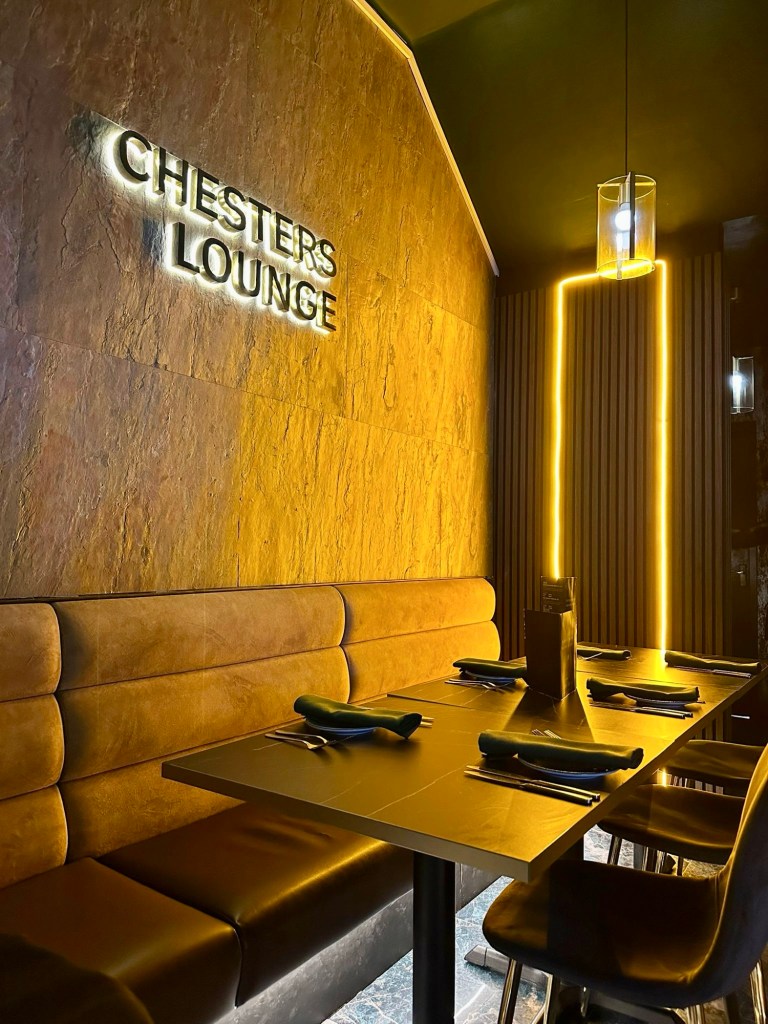 A stylish and modern Indian restaurant with warm lighting and a welcoming atmosphere.