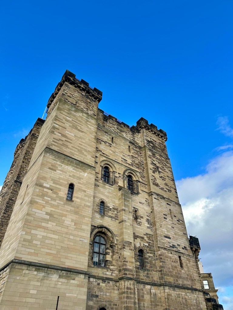 Newcastle Castle standing tall with its historic stone walls and arched entrance.