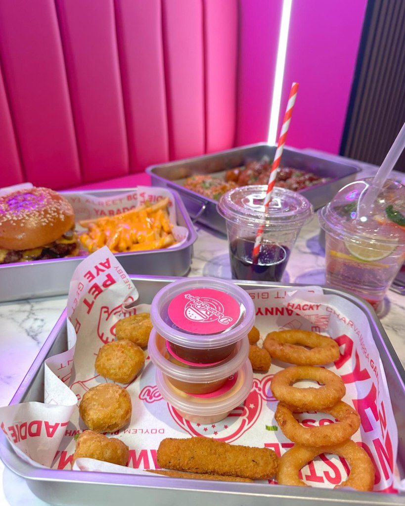 Crispy, golden onion rings served fresh at Dream Burger