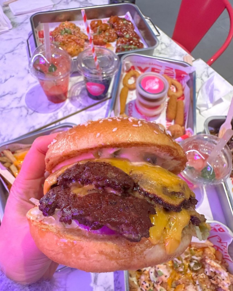 Fiery Angus Burger with a thick, juicy patty, spicy sauce, and fresh toppings at Dream Burger.