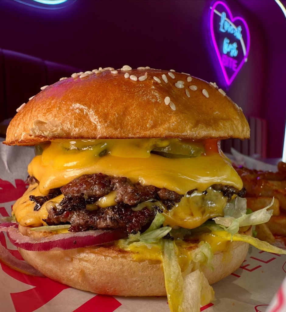 NY Burger at Dream Burger, served with melted cheese, fresh lettuce, and signature sauce in a soft bun