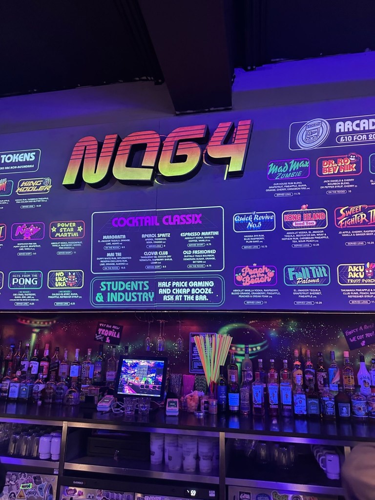 Eye-catching neon graffiti artwork covering the walls of NQ64 Newcastle, creating a bold and immersive retro-gaming atmosphere.