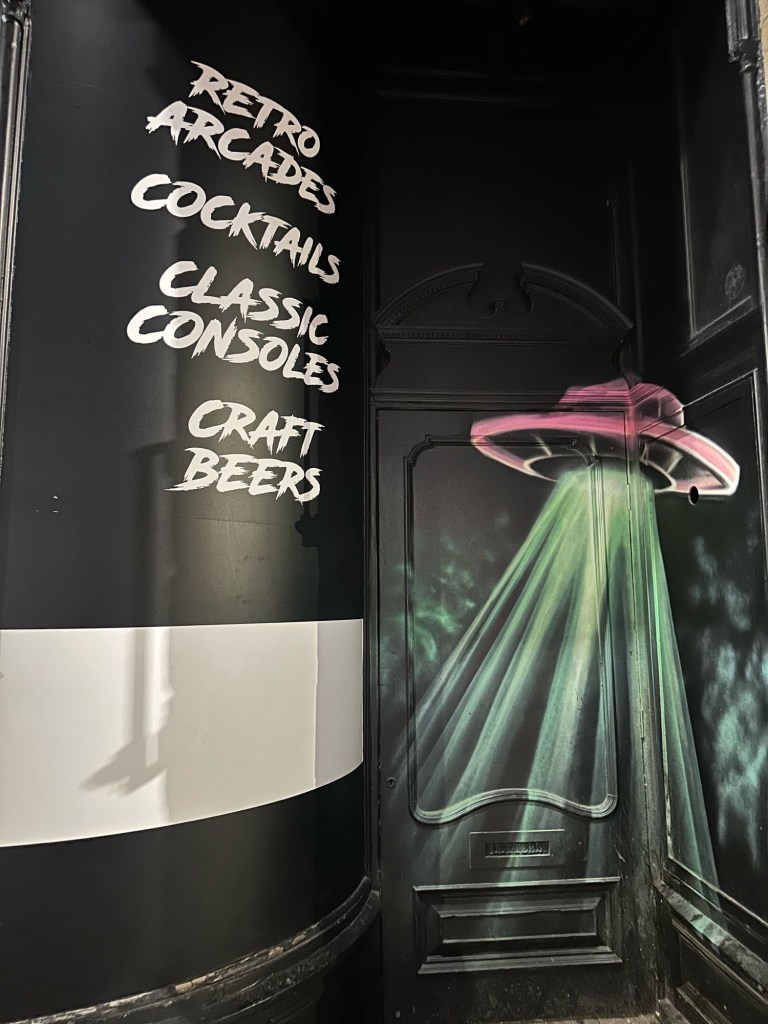 Eye-catching neon graffiti artwork covering the walls of NQ64 Newcastle, creating a bold and immersive retro-gaming atmosphere.