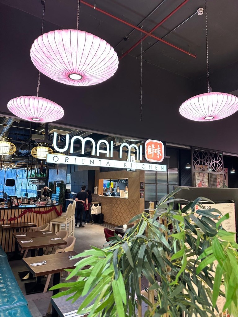 A stylish and modern dining space at Umai Mi, featuring sleek seating, ambient lighting, and contemporary Asian-inspired decor.