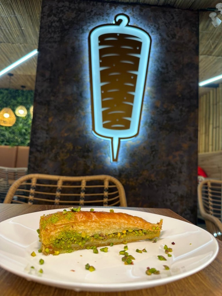 Pistachio baklava served with honey and filo pastry