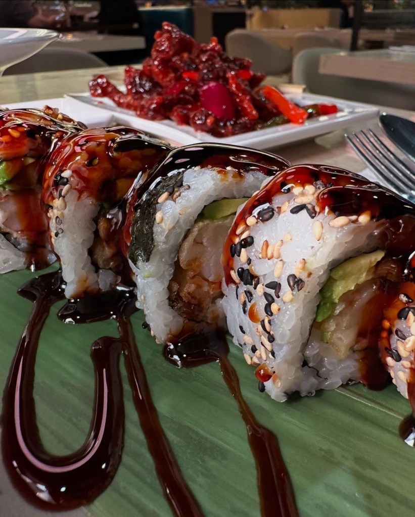 A detailed close-up of beautifully crafted sushi rolls, showcasing fresh ingredients and delicate presentation.