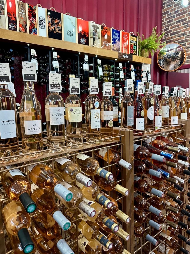 Shelves lined with an impressive selection of wine bottles from around the world at Newcastle Cavavin.