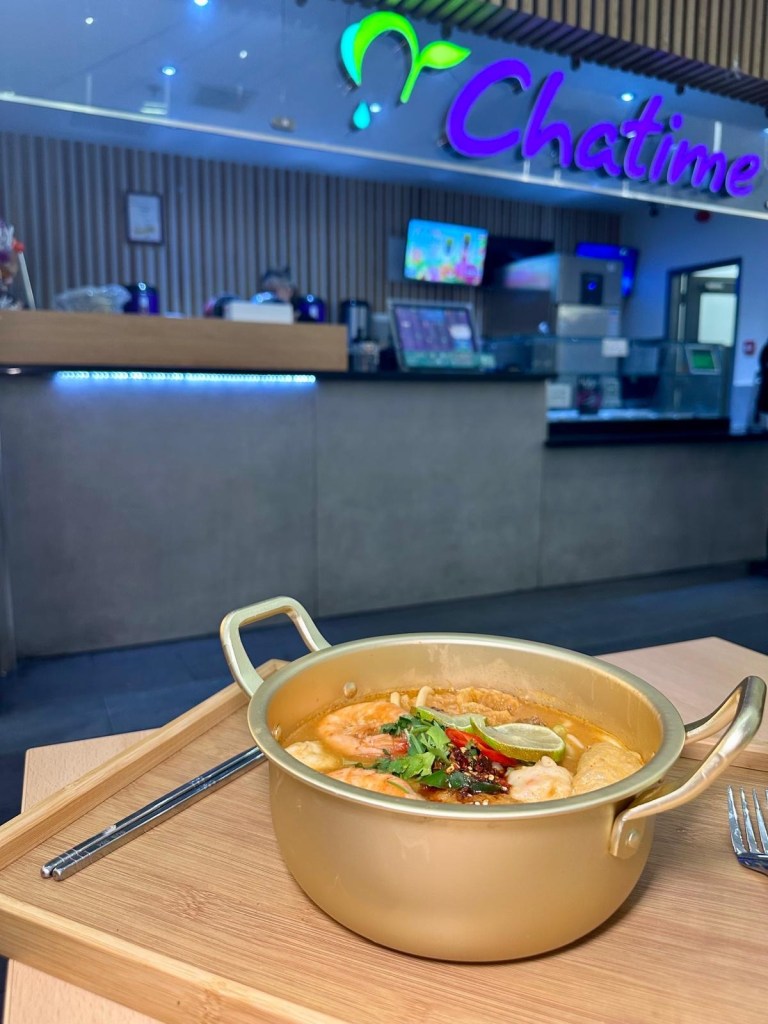A variety of fresh seafood ingredients, including prawns, fish balls, squid, and mussels, ready to be added to a Malatang hot pot.