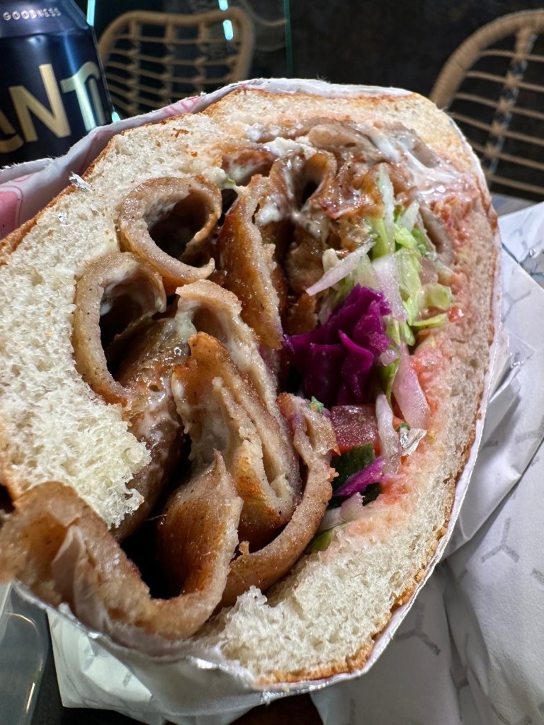 Authentic flame-grilled Turkish doner with mixed salad and signature sauces