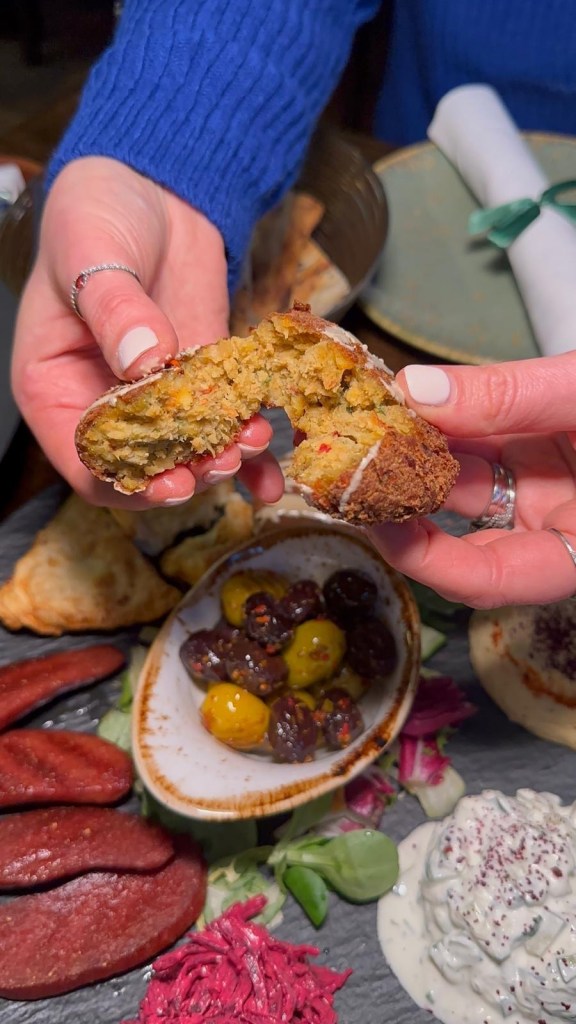 Lezzet Newcastle's Assorted Mix Platter with sucuk, falafel, muska böreği, hummus, beetroot salad, cacik, and olives