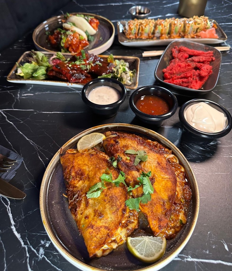 Soft tortillas filled with slow-cooked beef birria, loaded with melted cheese, and served with a rich consommé for dipping.