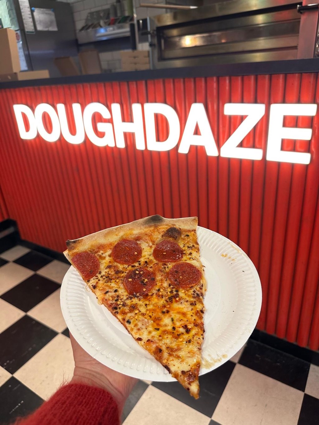 A 20-inch New York-style pizza with crispy, thin crust, topped with spicy pepperoni, gooey melted cheese, and a drizzle of sweet honey.