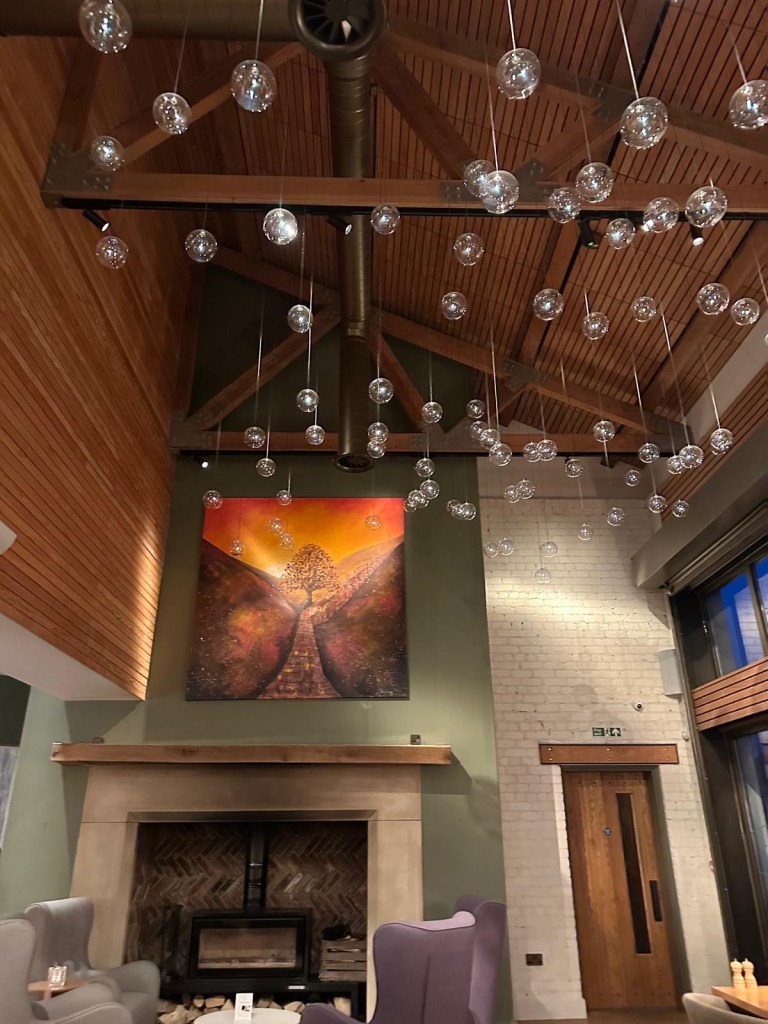 A cozy fireplace with soft ambient lighting, creating a warm and inviting atmosphere.