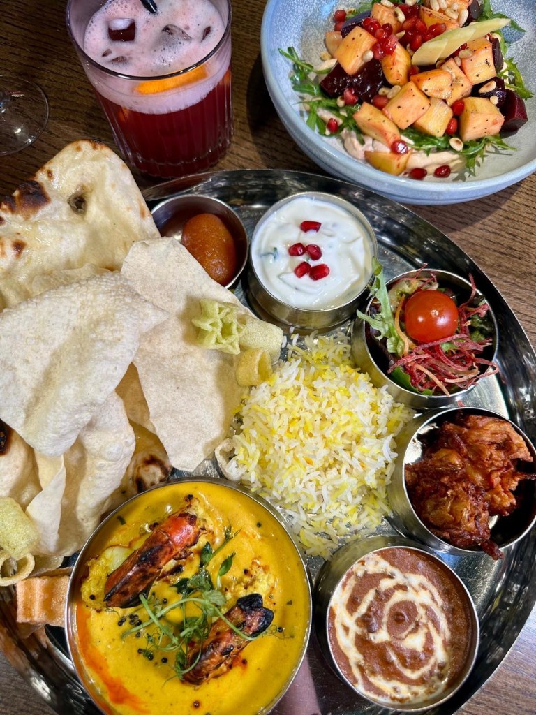 A vibrant spread of Dakwala’s Canteen Special Prawn Thali Platter, Bombay Chilli Cheese Toast, and Fresh Mango & Beetroot Salad.