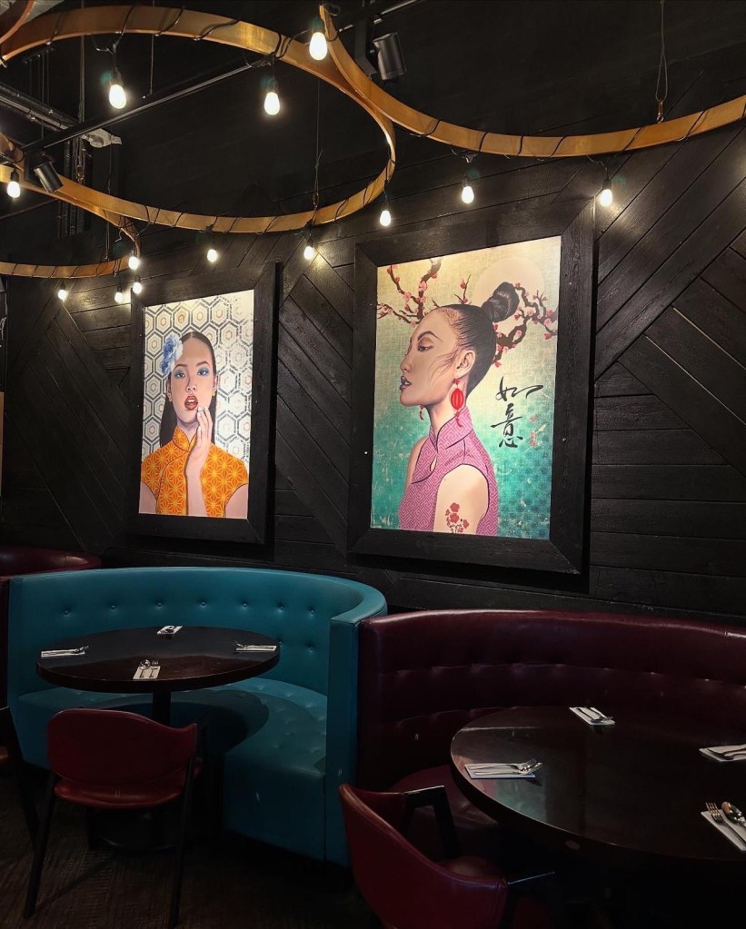 A stylish and modern dining space at Umai Mi, featuring sleek seating, ambient lighting, and contemporary Asian-inspired decor.