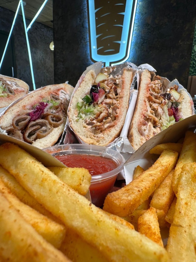 Flame-grilled Turkish and German doner kebabs served with seasoned fries